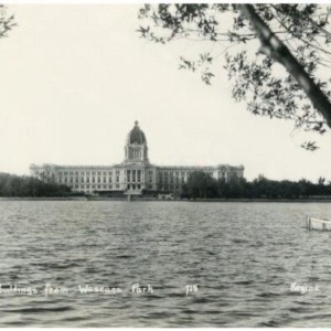 Image of the Legislative Building from afar, a lake is in front of it.